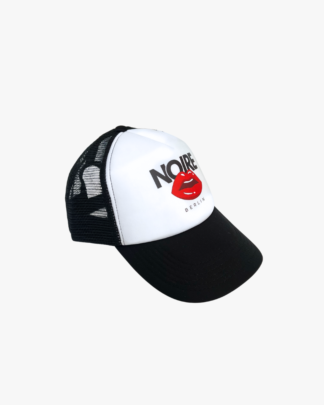 Side view of Noire Berlin/Noire Clothing Classic Black Trucker Cap featuring red lips logo and white front panel.