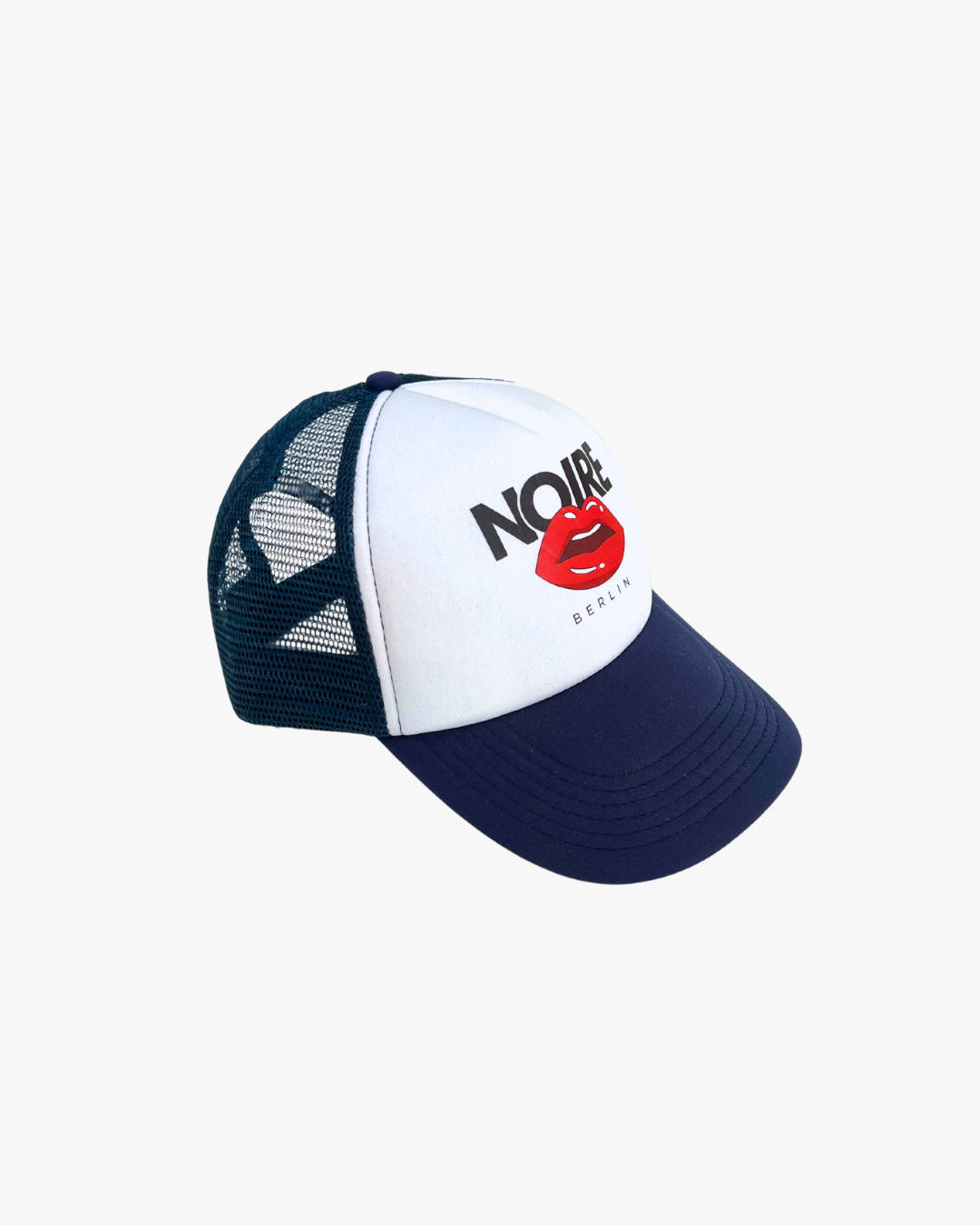 Side view of Noire Berlin/Noire Clothing Midnight Blue Trucker Cap featuring red lips logo and white front panel.